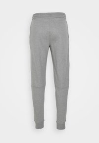 Graue Jogginghose aus einem weichen Baumwoll-Mix. Verfügt über einen gerippten Bund, schmal zulaufende Beine und kontrastierende Einsätze in der Nähe der Knie.