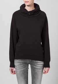 Felpa nera con collo a scaldacollo e maniche lunghe, realizzata in morbido cotone. Presenta una vestibilità aderente e un dettaglio sottile di texture tonale.