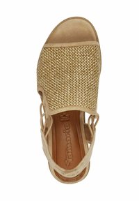 Sandal in pelle nera con tomaia intrecciata, punta aperta e cinturini regolabili. La soletta in pelle morbida e il design testurizzato migliorano il comfort e lo stile.