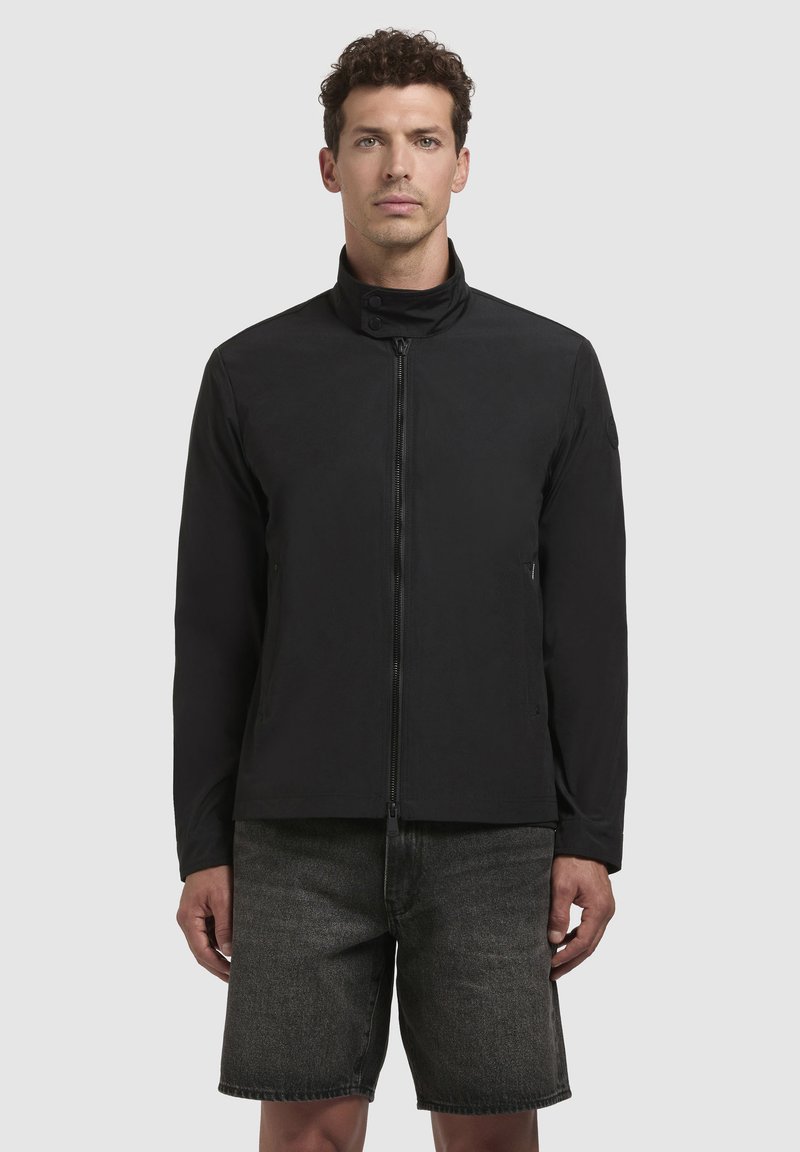 Black jacket with a high collar, front zipper, and side pockets. Made from a smooth, matte material, featuring a minimalistic design.