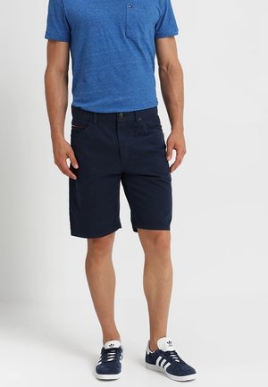 Navy blue shorts in a cotton blend with a slim fit, featuring front pockets and a button closure. Paired with a blue, textured crew-neck shirt.