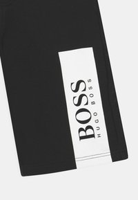 BOSS Kidswear BERMUDA - Teplákové kalhoty - black