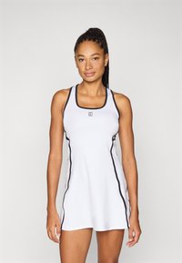 Λευκό αθλητικό φόρεμα με μαύρη επένδυση. Διαθέτει τετράγωνο λαιμόκοψη και σχέδιο racerback. Κατασκευασμένο από ελαστικό, ελαφρύ υλικό.