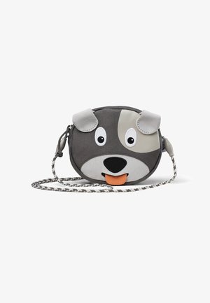 Round grey bag designed as a dog face, featuring 3D ears, large eyes, orange tongue, and a patterned strap. Made of durable fabric.
