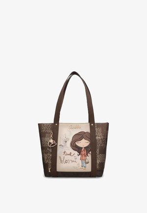 Sac à main marron et beige avec de longues poignées, présentant une fille de dessin animé, le texte "time to bloom," et un pendentif en forme de cœur sur le côté.