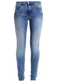 Jeans ajustados en denim azul claro con detalles desgastados. Presenta una cinturilla clásica y un ligero desvanecimiento para un aspecto usado.
