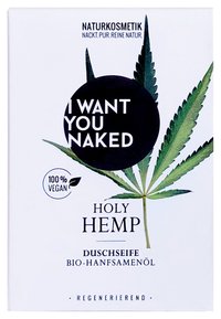 Vit förpackning med design av gröna hampalöv, med texten "JAG VILL HA DIG NAKEN" i fet svart stil och en cirkulär logotyp med texten "100% VEGANSK".