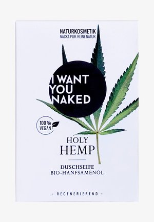 White packaging with green hemp leaf design, featuring the text "I WANT YOU NAKED" in bold black font and "100% VEGAN" circular logo.