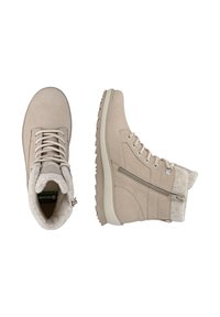 Las botas de tobillo beige tienen un exterior de ante, forro de lana, cordones redondos, ojales de metal y un cierre lateral para un fácil acceso. Suela de goma texturizada.