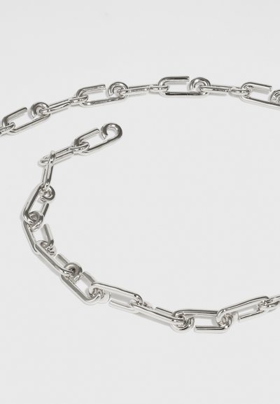 Silver chain necklace featuring interlocking links with a smooth finish. Consistent shape, shiny texture, and a clasp for fastening.
