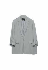 Blazer gris clair à un bouton avec manches retroussées et deux poches avant à rabat, présenté sur un fond blanc.