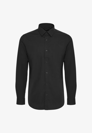 Mustikas värvi pika varrukaga särk, mis on valmistatud siledast kangast, omab nööpidega esiosa, teravat kraed ja kohandatud lõiget, millel on minimalism.