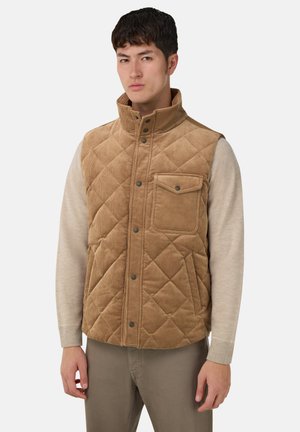 Brun quiltet vest lavet af kordfløjl, med høj krave, trykknaplukning og en frontlomme med klap.