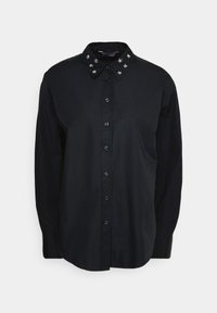 Camicia nera con bottoni e colletto a punta decorato con borchie. Presenta maniche lunghe e orlo dritto. Realizzata in cotone.