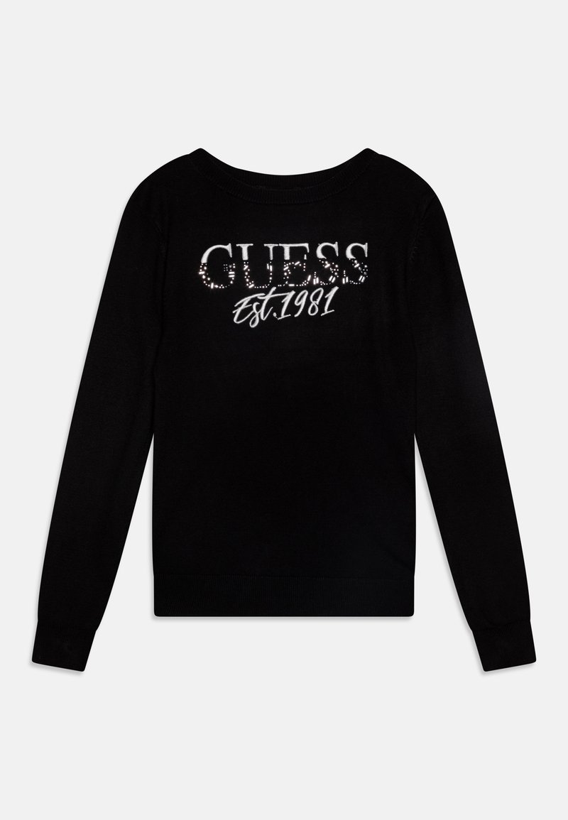 Chemise noire à manches longues avec « GUESS » et « Est. 1981 » imprimés sur le devant, avec de petits points réfléchissants sur le nom de la marque.