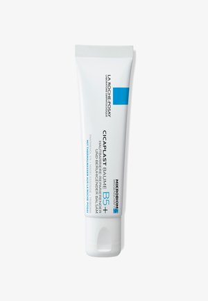 White tube of La Roche-Posay Cicaplast Baume B5+, featuring blue accents, smooth texture, and printed product information in various languages.