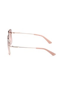 Gafas de sol metálicas color rosa dorado con lentes degradados en rosa, marco de alambre delgado y brazos de plástico en rosa pálido. Logo grabado en el lateral.