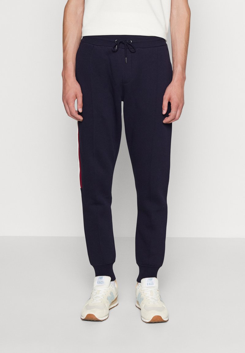 Tommy Hilfiger GLOBAL Tracksuit bottoms desert sky/dark blue