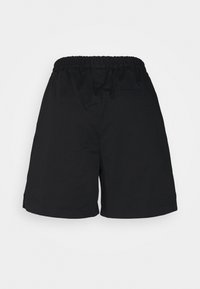Black elastic waist shorts with a single welt pocket on the back, displayed against a plain light background.