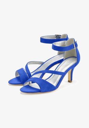 Blaue Wildleder-Absatzsandalen mit gekreuzten Riemen und einem Knöchelriemen. Mit geschlossener Zehenpartie und einer metallischen silbernen Innensohle.