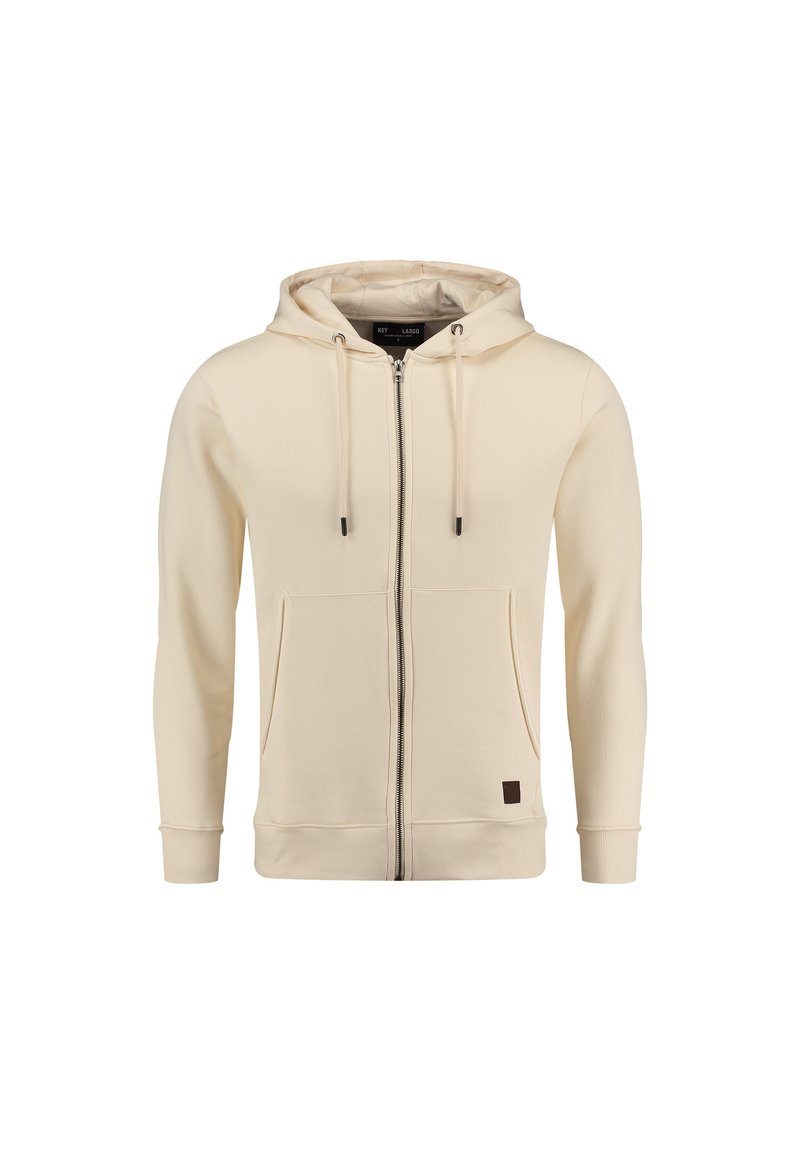Crème zip-up hoodie gemaakt van zachte stof, met een ritssluiting aan de voorkant, twee zijzakken en een capuchon met trekkoord. Bruin logo patch aan de onderkant.