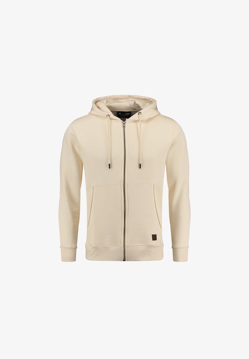 Sudadera cremosa con cremallera hecha de un tejido suave, con cierre frontal de cremallera, dos bolsillos laterales y capucha con cordón. Parche con logotipo marrón en el dobladillo.