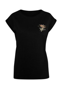 Svart t-skjorte med oppbrettede korte ermer, med et fargerikt brodert design av en mus på venstre brystområde.