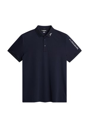 Marineblauwe polo gemaakt van een soepele stof. Heeft een kraag, twee knopen en merkaccenten op de mouw. Korte mouwen, klassieke pasvorm.