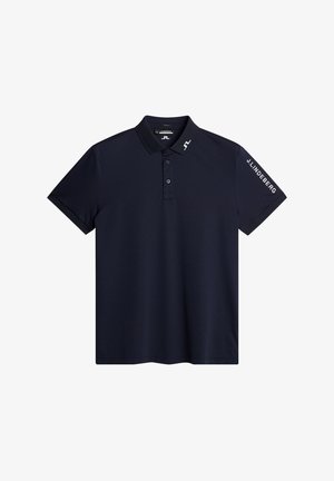 Marinblå pikétröja i ett mjukt tyg. Har en krage, två knappar och märkta detaljer på ärmen. Korta ärmar, klassisk passform.