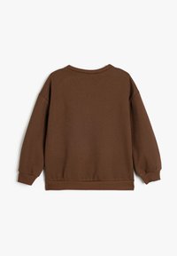 Felpa marrone con una vestibilità comoda, polsini e orlo a costine e una texture liscia. Presenta un collo a giro e un design con spalle scese.