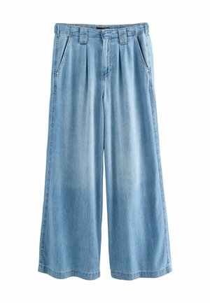 Platėjantys džinsai - mid blue