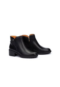 Bottines en cuir noir avec des zips latéraux, des accents texturés, des talons blocs bas et une finition lisse. Doublure intérieure en tan contrasté.