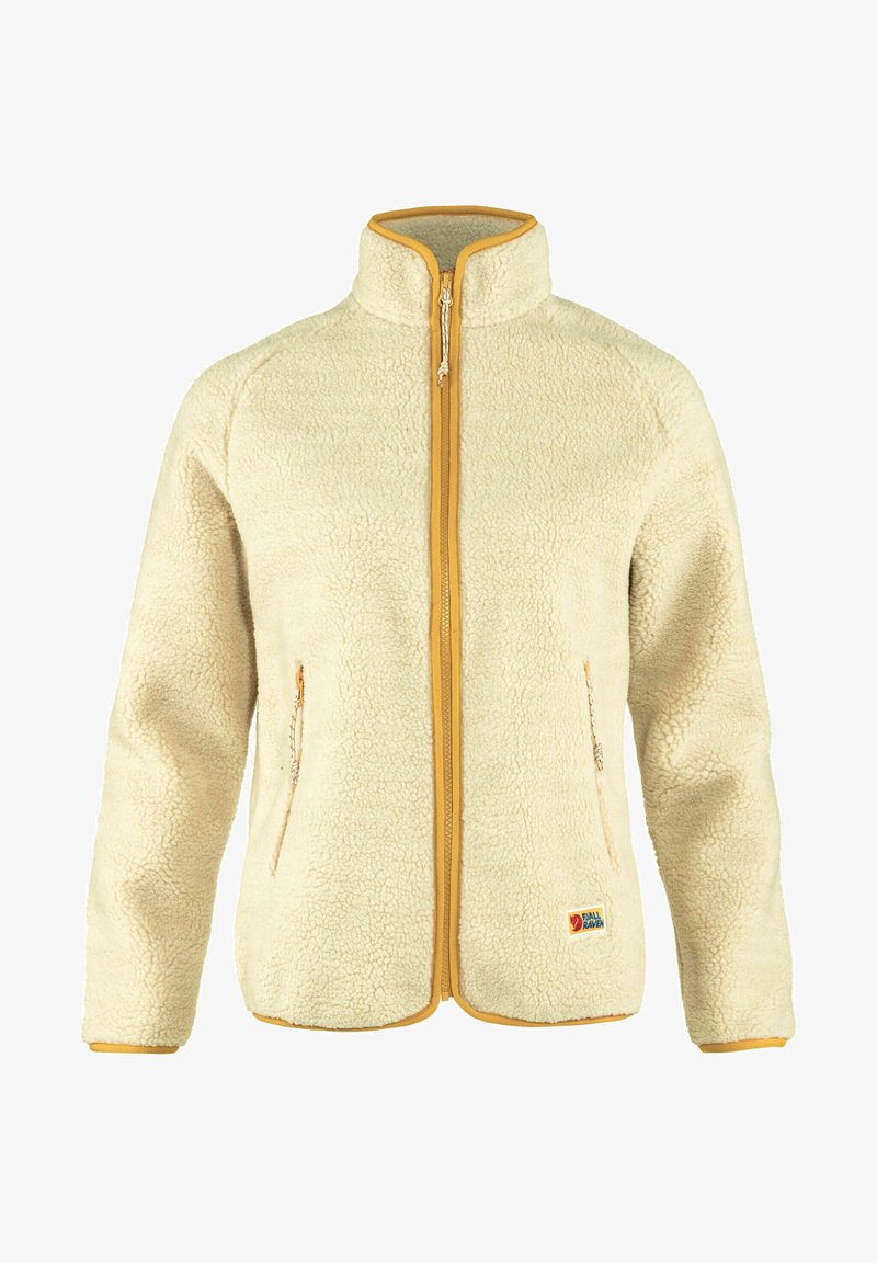Beige fleece jacket with a high collar, yellow zipper, and contrasting trim. Features side pockets and a patch logo on the lower front.