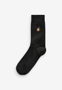 Black cotton sock featuring a small, colorful cartoon character embroidered near the ankle, smooth texture, and standard sock shape.