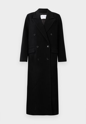 Black wool coat with a double-breasted design, large notched lapels, front pockets, and six matching buttons. Long, straight cut.