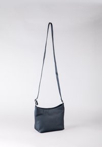 Grey leather crossbody bag with a smooth texture, single adjustable strap, and a minimalist design, featuring a top opening.