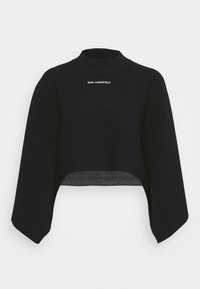 Pull court noir à larges manches avec le logo Karl Lagerfeld sur la poitrine, présentant un col rond haut.