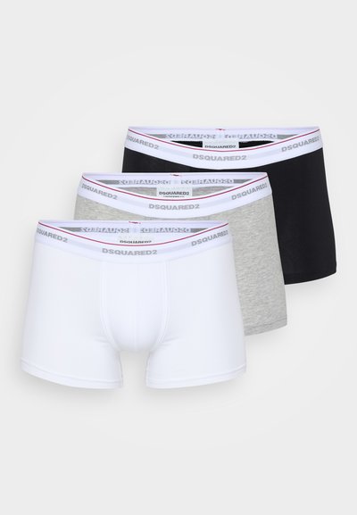 Three pairs of boxer briefs: white, grey, and black. Each has a seamless design and a branded elastic waistband with contrasting colors.