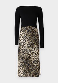 Long-sleeved dress featuring a ribbed black top and a leopard print skirt in shades of gold and black, with a smooth texture.
