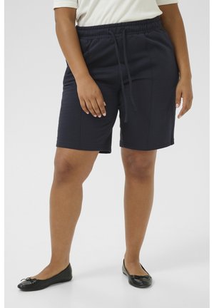 Marineblauwe, knielange shorts van zachte stof met een elastische tailleband en een trekkoorddetail, voorzien van zijzakken voor functionaliteit.