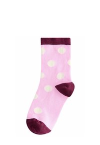 Roze čarape s bijelim točkicama, s bordo rebrastim rubom, prstom i petom. Mekani materijal, dužine do sredine lista.