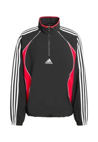 Čierno-červená bunda so štvrťzipsom, bielymi pruhmi, z nylonového materiálu, s golierom typu funnel a elastickými manžetami. Na hrudi logo Adidas.