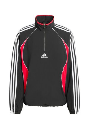 Czarna i czerwona kurtka z zamkiem do pół wysokości, z białymi paskami, wykonana z nylonu, z kołnierzem typu komin i elastycznymi mankietami. Logo Adidas na piersi.