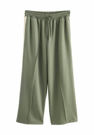 Roheline laienev pükste paar elastse vöökoha ja nööriga. Omab küljetaskuid ja sileda tekstuuri.