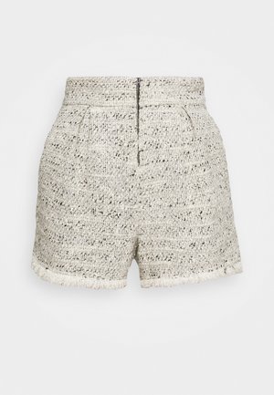Naisten korkeavyötäröiset tweed-shortsit kermaan ja mustaan värissä, joissa on vetoketju edessä, laskokset, sivutaskut ja repsottava helma.