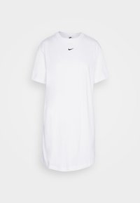Bílá bavlněná tričko s kulatým výstřihem, krátkými rukávy a malým černým logem Nike na hrudi. Ležérní a volný střih.