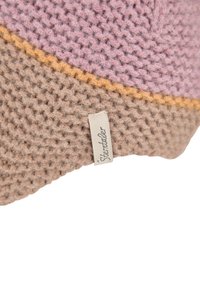 Textured knit hat in pink, brown, and orange hues, featuring a label on the side. The material appears soft with a cozy finish.