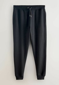 Pantaloni della tuta neri con vita con coulisse, tasche laterali e polsini a costine. Realizzati in tessuto liscio ed elastico per il massimo comfort.