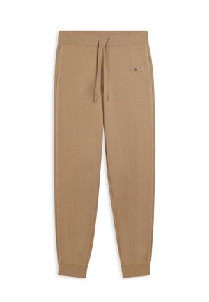 Pantaloni sportivi beige con vita elastica e cordino, dotati di strisce laterali e un accento metallico con logo sulla coscia sinistra.