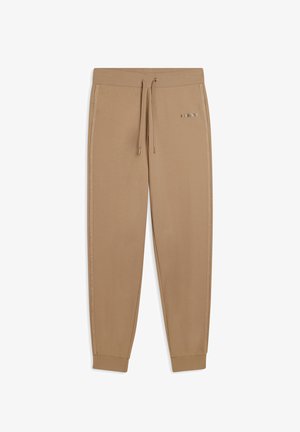 Pantaloni sportivi beige con vita elastica e cordino, dotati di strisce laterali e un accento metallico con logo sulla coscia sinistra.
